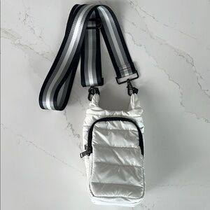 Chic Black and White Quilted Crossbody Bag with Striped Strap